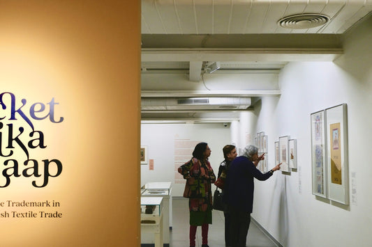 People viewing artwork in a modern exhibition gallery