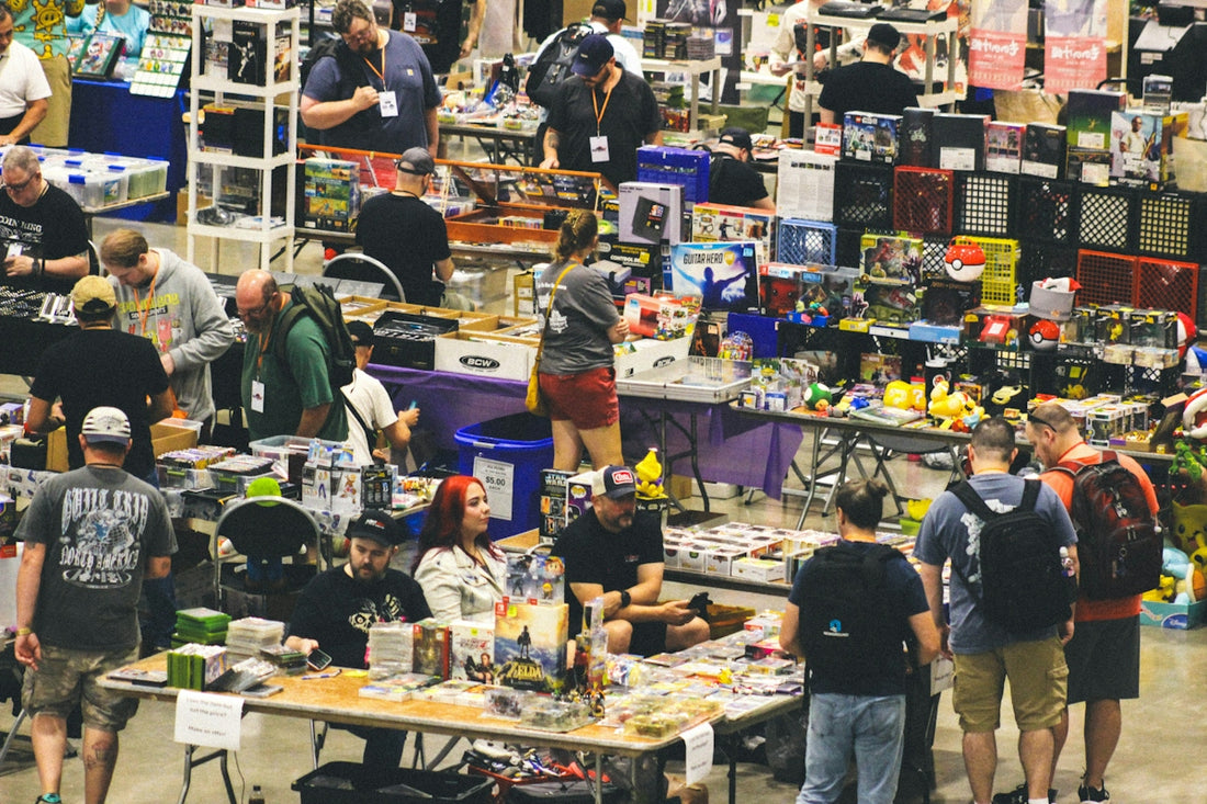 Many people browsing merchandise at a busy indoor market event